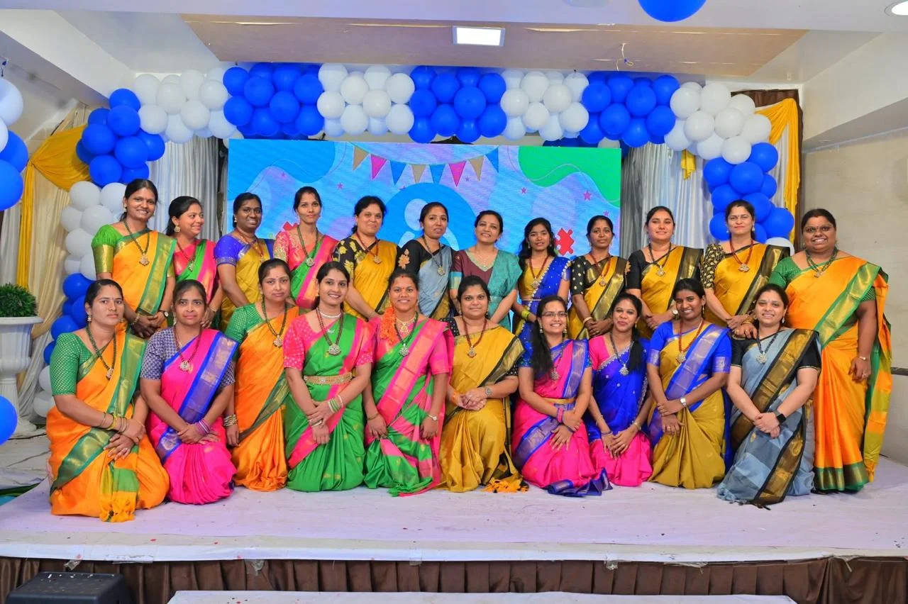 The AbilityElevate team together on stage at a school celebration